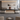 Modern Executive Desk with Dual-Tone, Side Storage & Fluted Front  — front view in a commercial office