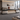 Modern Executive Desk with Dual-Tone, Side Storage & Fluted Front  — 45 degree view in a commercial office
