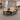 Modern Office Desk with Built-In Outlets, Cable Management & Glass Top  — 45 degree view in a commercial office