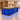 Black marble L-shaped counter with blue-lit mesh shelves in the same office, 45-degree view