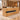 Honey oak reception counter with black recessed panel in the same office, 45-degree view