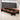 Brown closed elongated ring conference table with black panel supports in the same office, closer product view