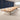 Oak conference table with ivory central cable band, two dark cable covers and ivory cabinet pedestal in the office, full room view