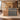 Natural wood and gray stone reception desk with slatted front in a furnished office, front view