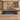 Gray brown wood and charcoal executive desk with right side storage and silver trim in a furnished office, front view