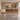 Cream rounded walnut-front illuminated reception counter front view in a furnished office