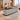 Gray marble reception counter with black top in the same office, 45-degree view