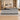 Gray marble reception counter with black top in an office, front view