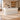 White fluted reception counter in the same furnished office lobby, dimension-based 45-degree view