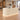 Cream fluted curved reception desk with base lighting in the same office, 45-degree view